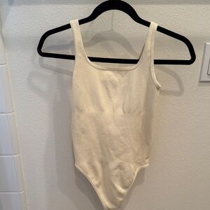 Chic Cream Ribbed Bodysuit